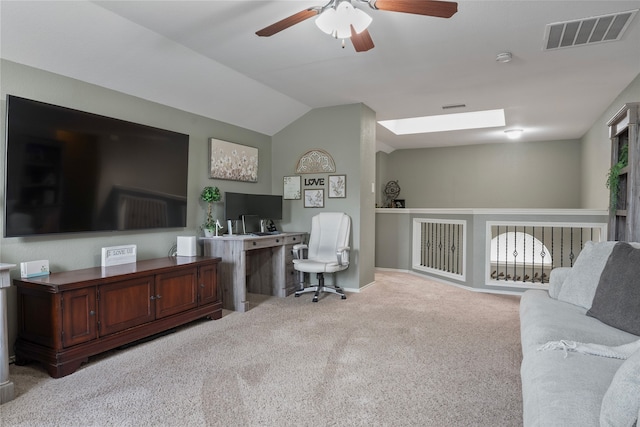 office with vaulted ceiling, light colored carpet, and ceiling fan