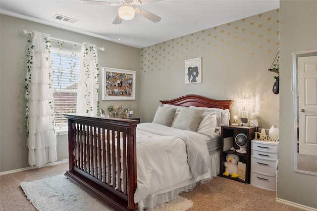 bedroom featuring light colored carpet and ceiling fan