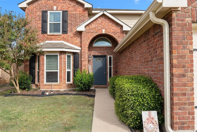 628 Destin Dr, Fort Worth, TX 76131 - property entrance featuring brick siding and a yard