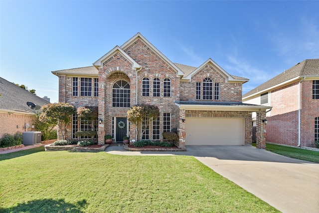 view of front facade featuring a garage, a front lawn, and central air condition unit