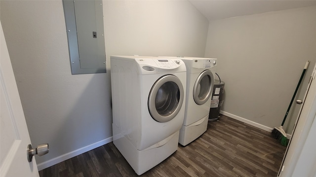 laundry room with electric panel, dark wood-type flooring, and washing machine and dryer