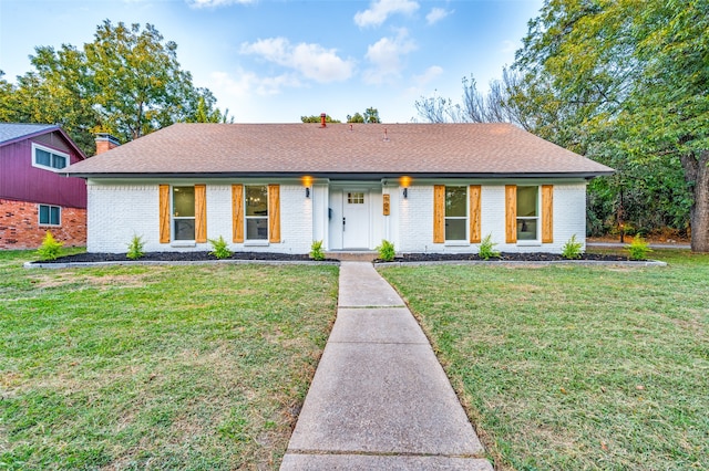 ranch-style home with a front yard