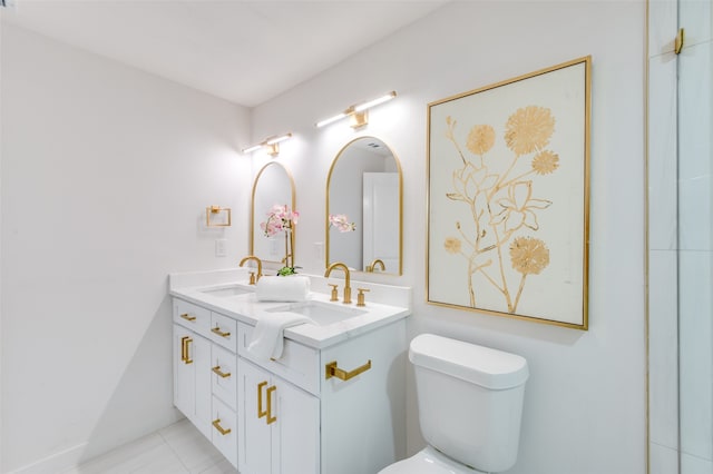 bathroom featuring vanity, toilet, and tile patterned floors