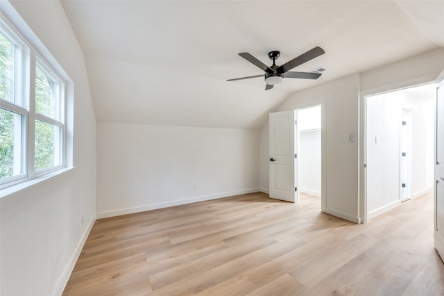 bonus room featuring light hardwood / wood-style floors, lofted ceiling, and ceiling fan