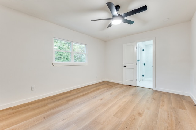 spare room with light hardwood / wood-style floors and ceiling fan