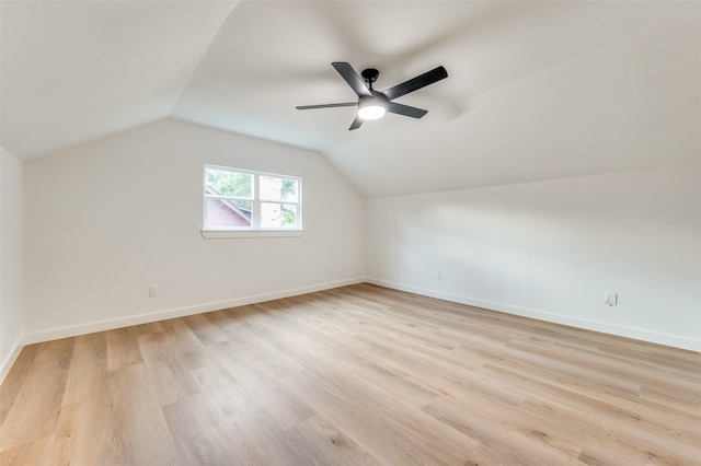 bonus room with lofted ceiling and light hardwood / wood-style flooring