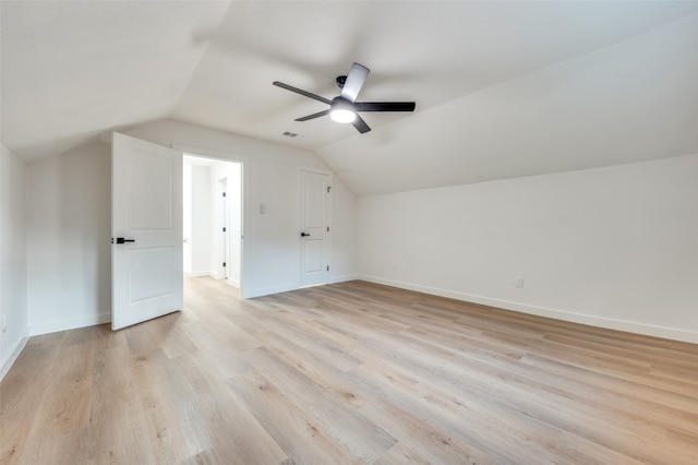 bonus room with vaulted ceiling, light hardwood / wood-style flooring, and ceiling fan