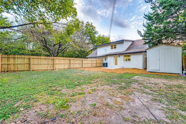 view of yard with a patio area and a storage unit