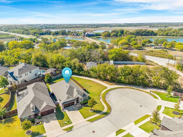 birds eye view of property with a water view