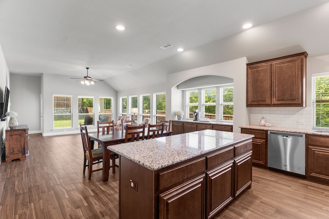 kitchen featuring dishwasher, a healthy amount of sunlight, and light wood-type flooring