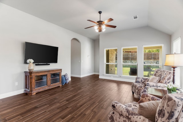 living room featuring dark wood-type flooring, vaulted ceiling, and ceiling fan