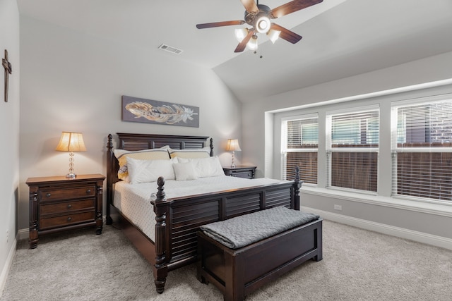 bedroom featuring ceiling fan, light carpet, and lofted ceiling