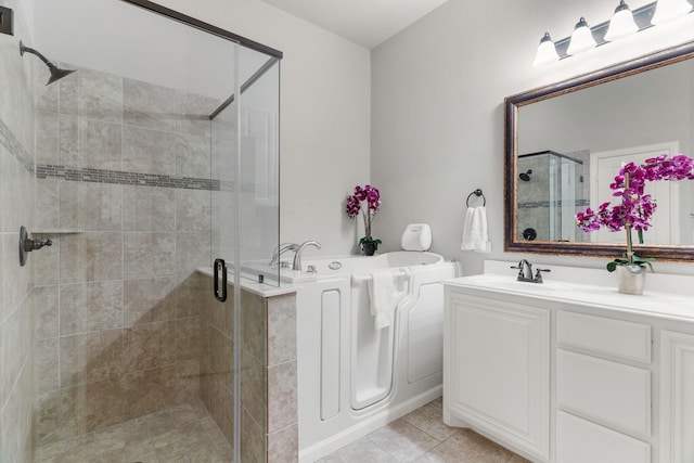 bathroom featuring vanity, tile patterned floors, and independent shower and bath