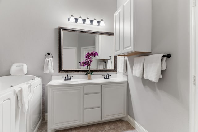 bathroom with vanity and tile patterned floors