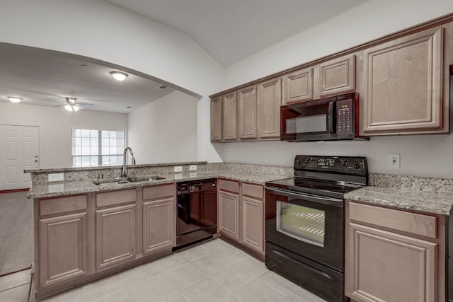 kitchen featuring kitchen peninsula, ceiling fan, vaulted ceiling, black appliances, and sink