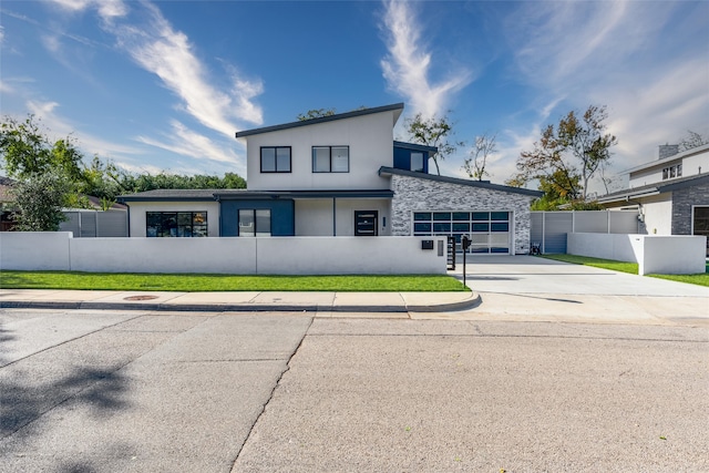 contemporary home featuring a front lawn