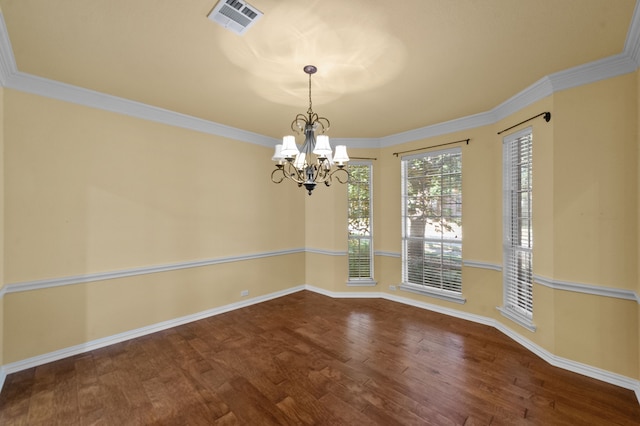 unfurnished room with a notable chandelier, ornamental molding, and wood-type flooring