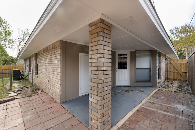 property entrance featuring a patio and central AC