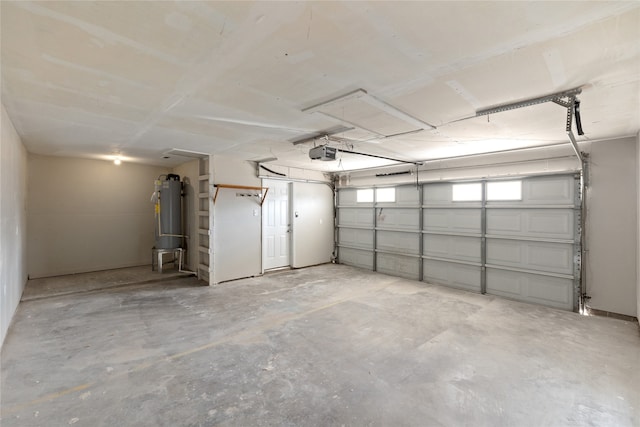 garage with a garage door opener and water heater