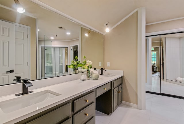 bathroom featuring tile patterned floors, vanity, and crown molding