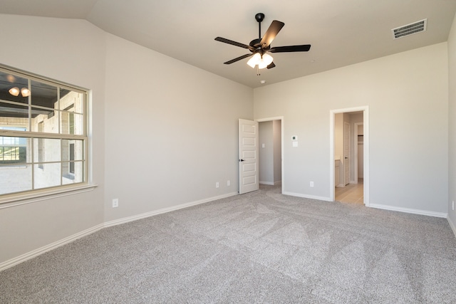 unfurnished bedroom with ceiling fan, light carpet, and vaulted ceiling