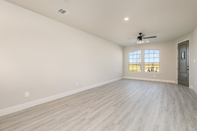 unfurnished room featuring ceiling fan and light wood-type flooring