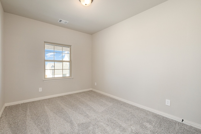 spare room featuring carpet flooring