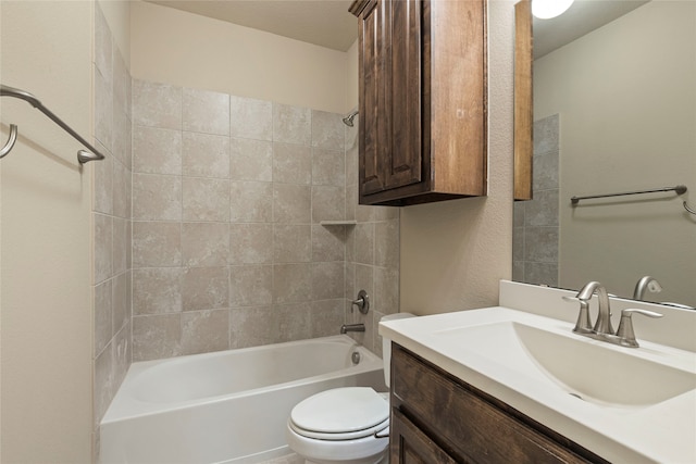 full bathroom with vanity, toilet, and tiled shower / bath