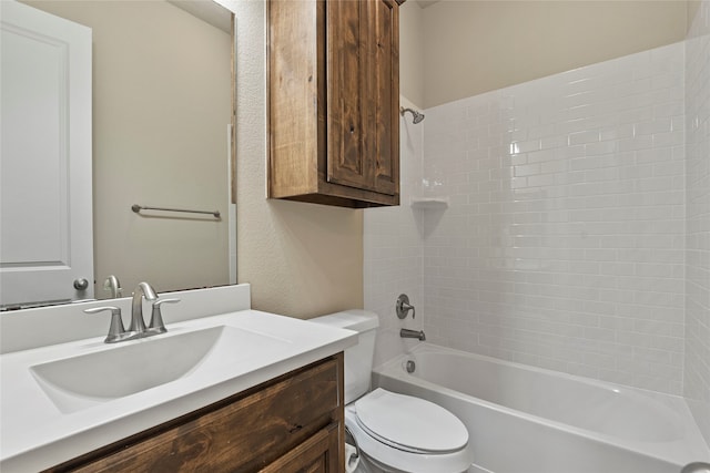 full bathroom featuring vanity, toilet, and tiled shower / bath