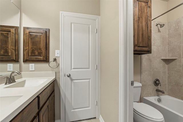 full bathroom with vanity, toilet, and tiled shower / bath