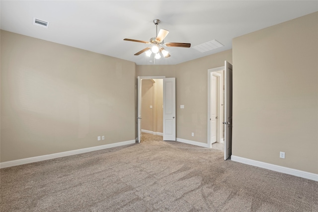 carpeted empty room featuring ceiling fan