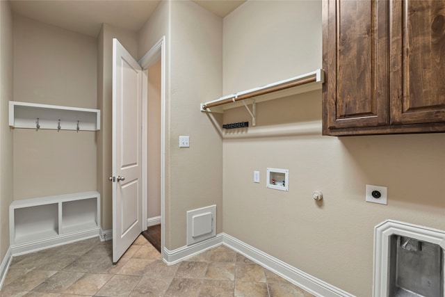 laundry area featuring electric dryer hookup, gas dryer hookup, cabinets, and washer hookup