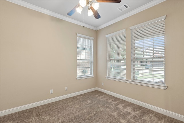 carpeted empty room featuring ceiling fan and crown molding