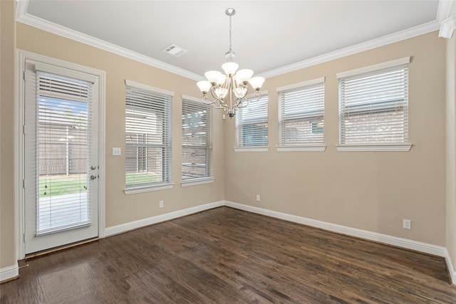 unfurnished dining area with a notable chandelier, crown molding, dark wood-type flooring, and a wealth of natural light