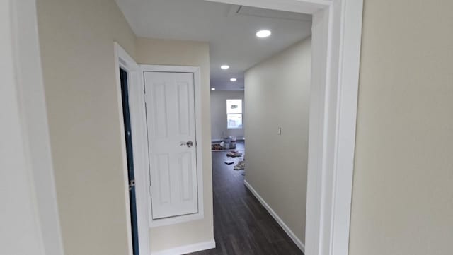 corridor with baseboards, dark wood-style flooring, and recessed lighting