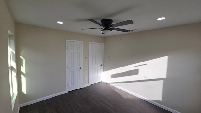 spare room featuring a ceiling fan, baseboards, wood finished floors, and recessed lighting