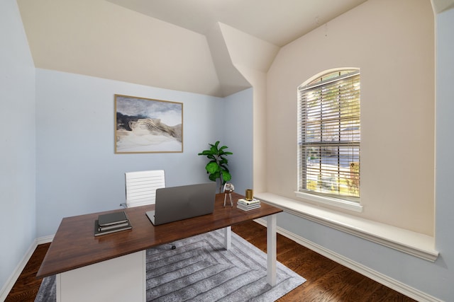 bedroom featuring ceiling fan, dark hardwood / wood-style flooring, and vaulted ceiling