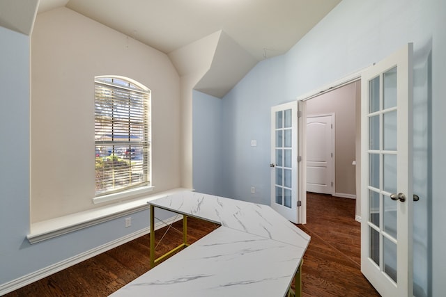 bedroom with vaulted ceiling, connected bathroom, ceiling fan, and dark hardwood / wood-style floors