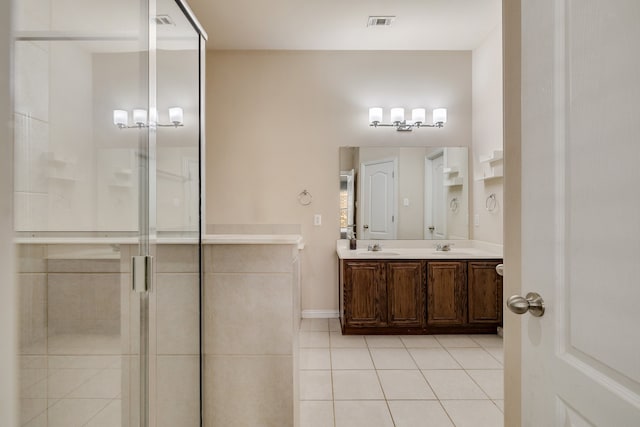 bathroom with tile patterned floors, vanity, and independent shower and bath