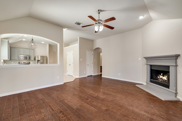 bedroom with ceiling fan, carpet floors, and vaulted ceiling