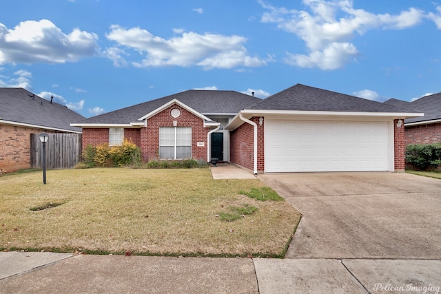 ranch-style house with a front yard and a garage