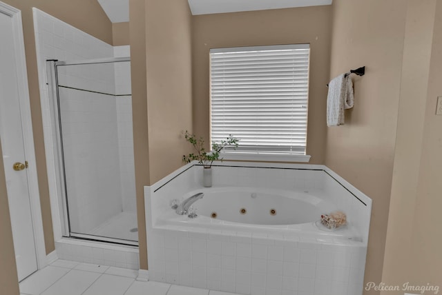 bathroom with separate shower and tub and tile patterned flooring