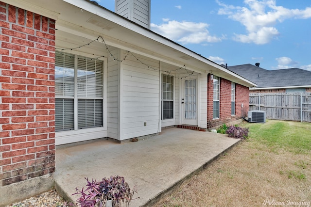 exterior space with a yard, a patio, and central AC unit