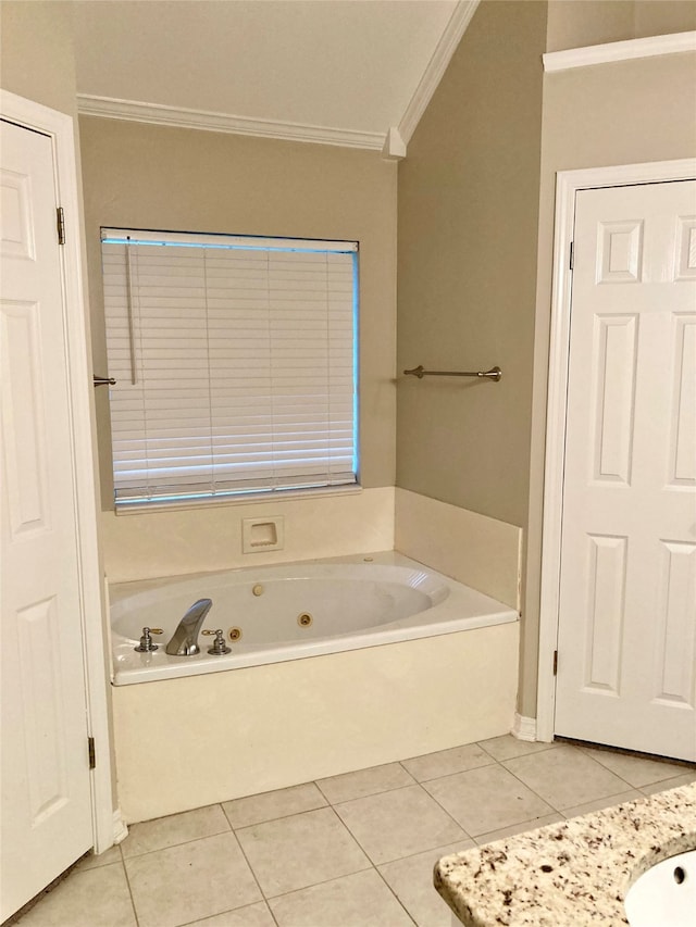 bathroom with a bathing tub, crown molding, and tile patterned floors