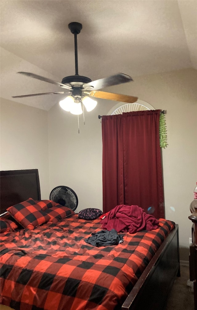 bedroom featuring ceiling fan and lofted ceiling