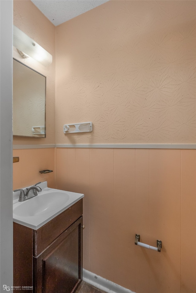 bathroom with vanity and a textured ceiling