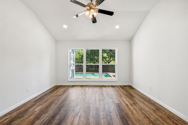 empty room featuring ceiling fan, lofted ceiling, and dark hardwood / wood-style floors