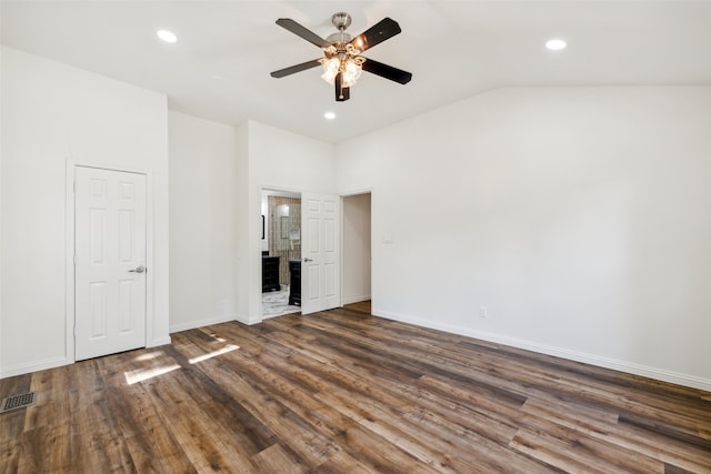 unfurnished bedroom featuring dark wood-type flooring, ceiling fan, and lofted ceiling