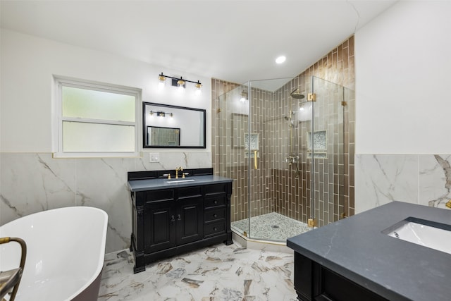 bathroom featuring vanity, independent shower and bath, and tile walls