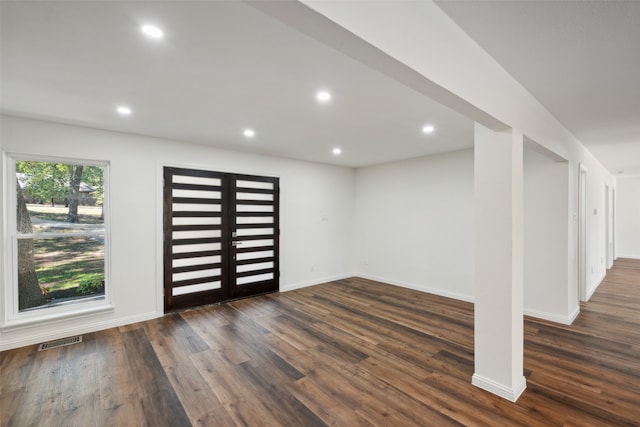 entryway with dark hardwood / wood-style floors